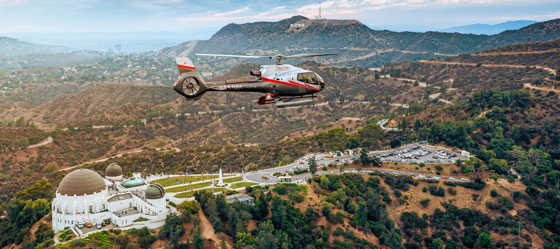 Maverick Helicopters flying over Griffith Observatory in Los Angeles