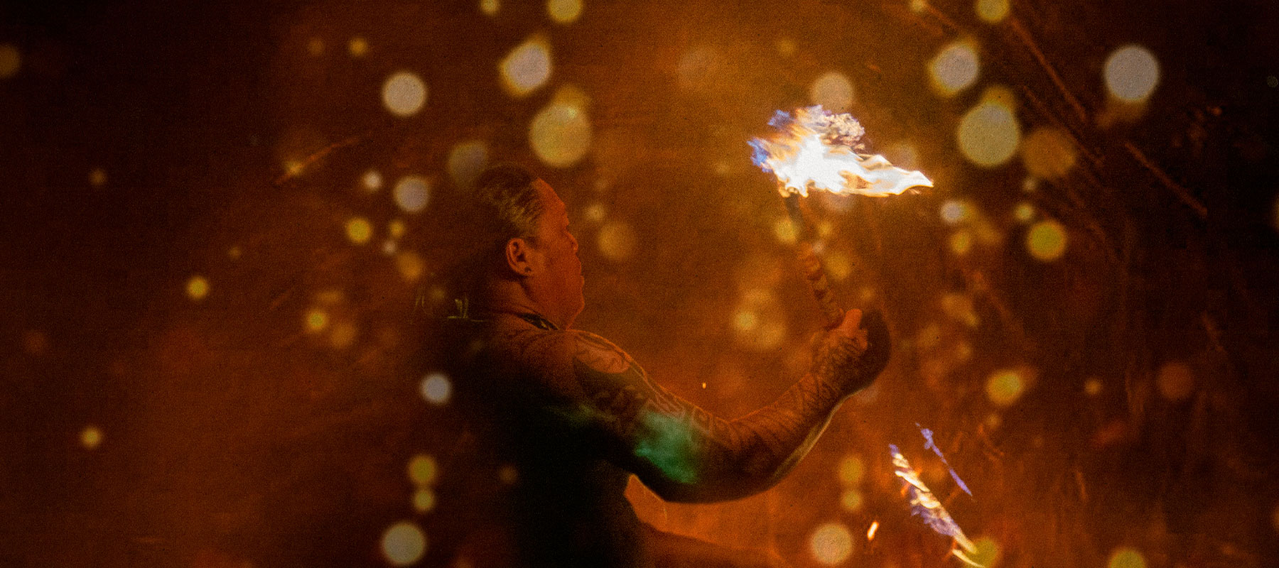 Fire torch dancer performing at the luau