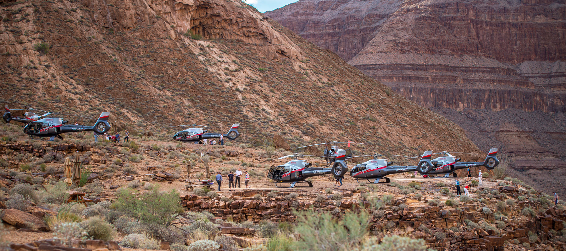 Expansive views of the Grand Canyon’s colorful rock formations from our private landing spot
