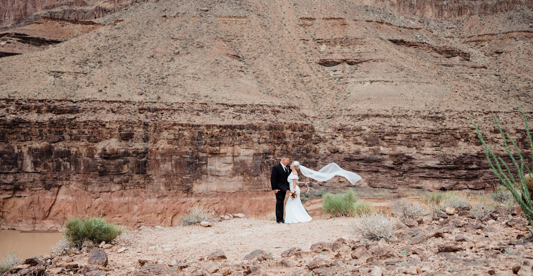 Bride and groom enjoying a destination wedding in the heart of the Grand Canyon