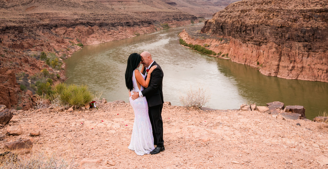 In love and in awe, the couple enjoys their Grand Canyon sunset wedding