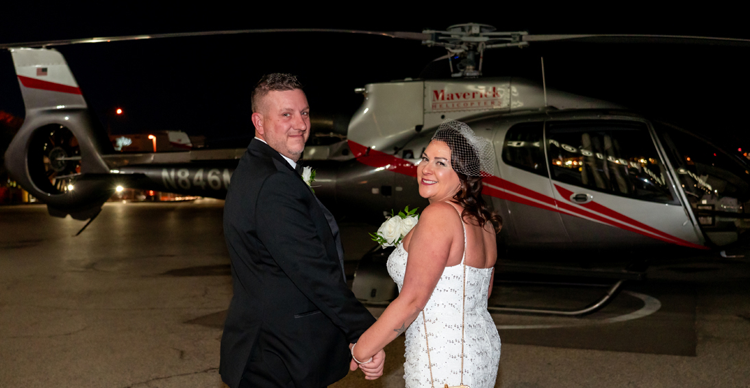 A romantic helicopter night wedding featuring Las Vegas iconic landmarks and champagne toast prior to flight