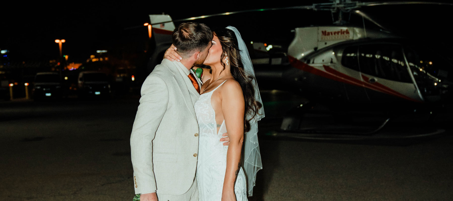 A Las Vegas helicopter wedding couple sharing a moment on the tarmac at night
